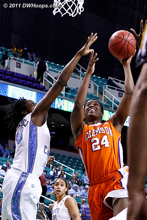 Tate gets the shot just over Broomfield's hand  - CLEM Players: #24 Jasmine Tate - UNC Tags: #33 Laura Broomfield 