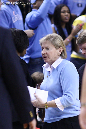 Coaches shake hands at midcourt  