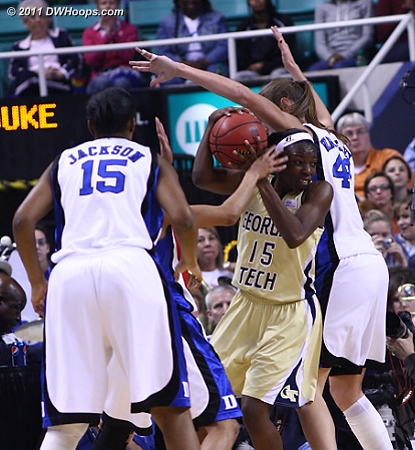 Marshall gets out of a triple team in the corner  - Duke Tags: #43 Allison Vernerey - GT Players: #15 Tyaunna Marshall 