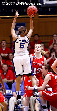 Jasmine hits a third straight jumper, but at the lower right note Erica Allenspach going down