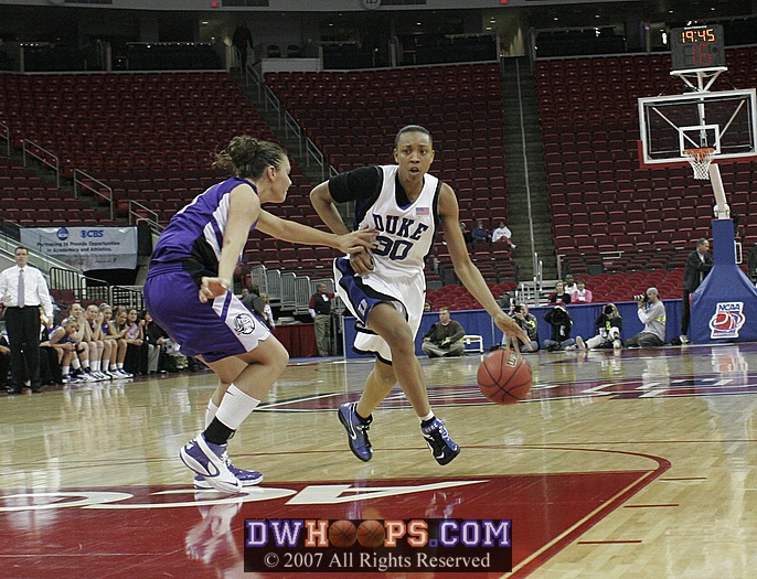 Ashley McLaughlin gets a hand on Carrem Gay, who was called for the travel