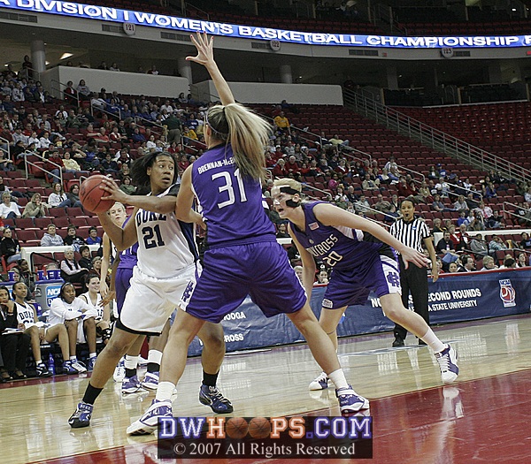 Joy Cheek works against Brennan-McBride and Merrihue with just over a minute to play