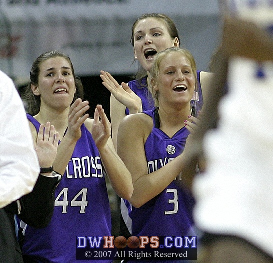 Holy Cross players applaud Brittany Keil's 1,000 point achievement