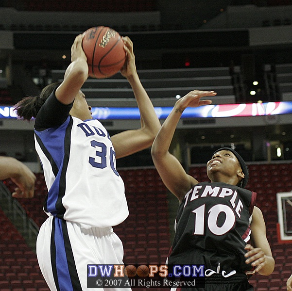 Carrem Gay yanks down the offensive board from Harding's miss
