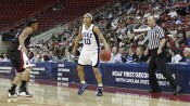  - Lindsey Harding encourages her teammates to get into position