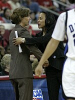  - Coach G and Coach Staley meet at midcourt.