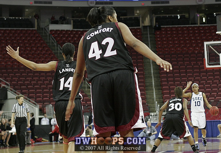 Landry tries to fire up the Temple crowd as Harding brings the ball up for Duke