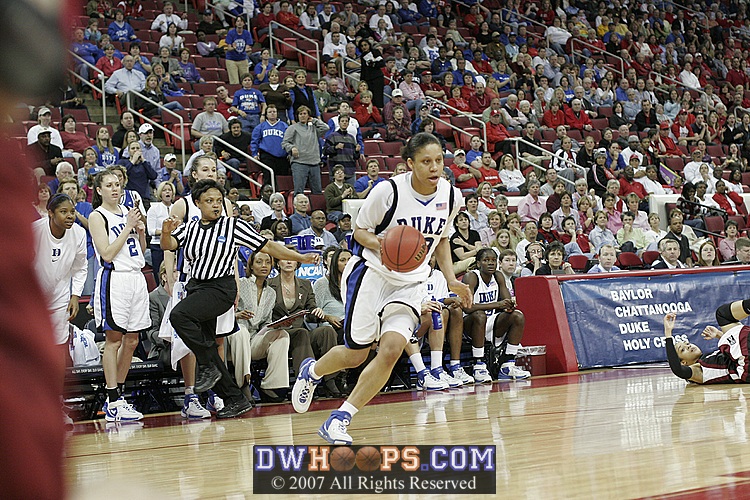 As the bench cheers, Wanisha Smith drives