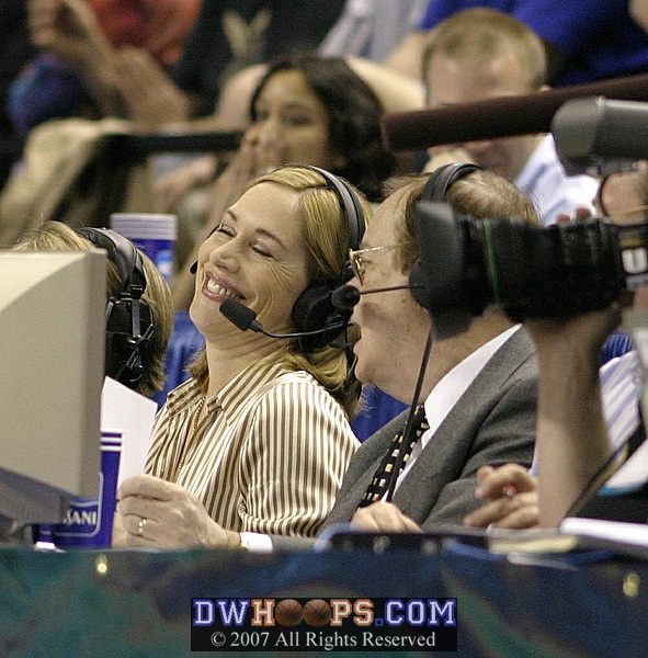 ESPN's Doris Burke shares a light moment with Mike Patrick during a break