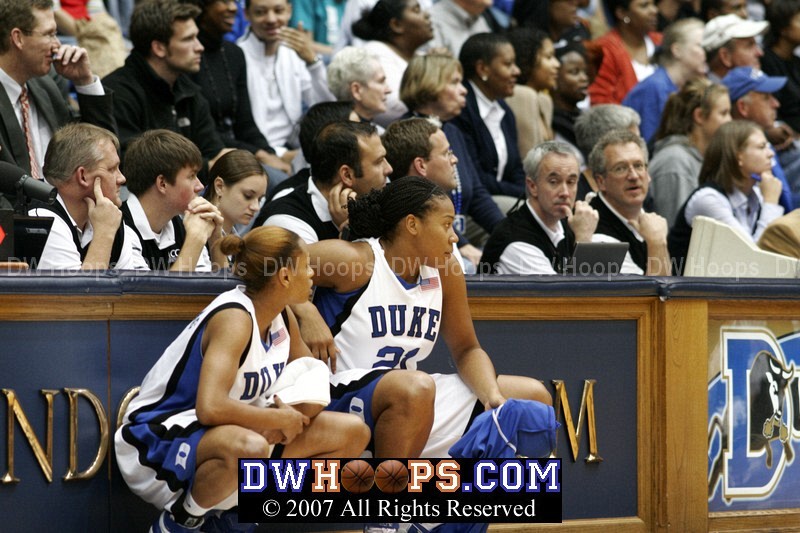 Jasmine Thomas and Joy Cheek wait for a break in the action to enter