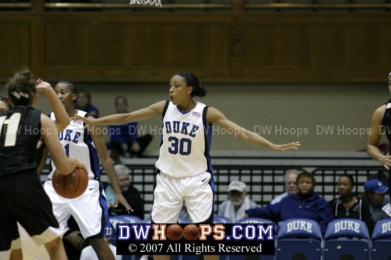 Carrem Gay and Chante Black (left) pose a considerable defensive obstacle for Team Reebok's Sidney Spencer