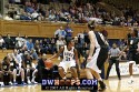  - Duke's Keturah Jackson, guarded by Sidney Spencer and Sherell Sowho (right), considers her next move