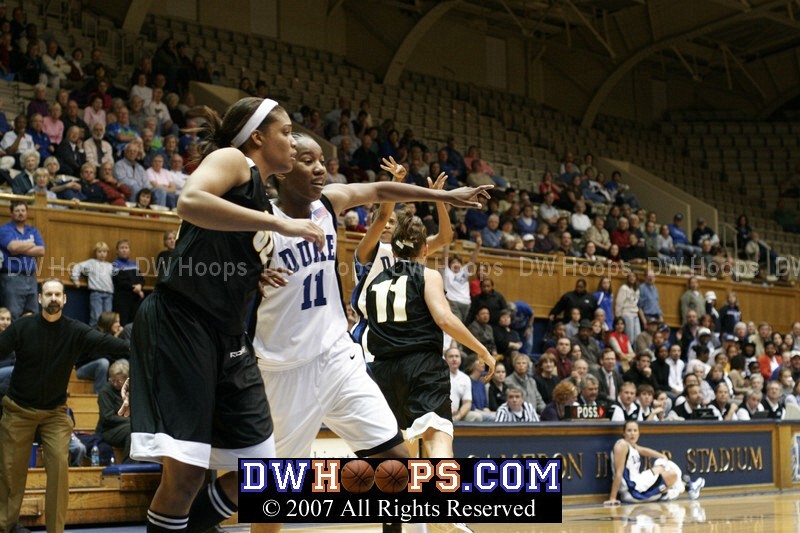 Team Reebok's Courtney McDaniel and Duke's Chante Black battle for position as  Jasmine Thomas launches a shot from outside