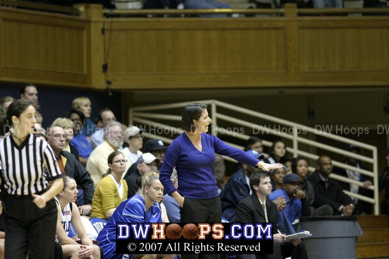 Coach P provides direction to her team on the defensive end
