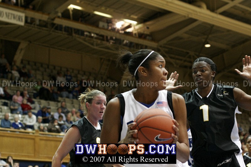 Tynecia Pam doesn't want to foul Duke's Krystal Thomas, who just pulled down an offensive rebound