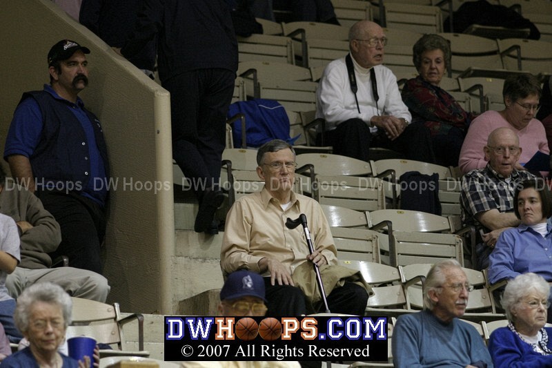 Dr. F. Belton Joyner looks on from Row F