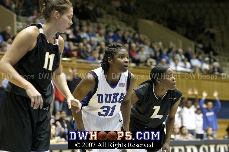 Duke's Keturah Jackson on the blocks between former college stars Sidney Spencer and Leah Metcalfe