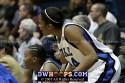  - Chante Black and Krystal Thomas encourage their teammates from the sidelines