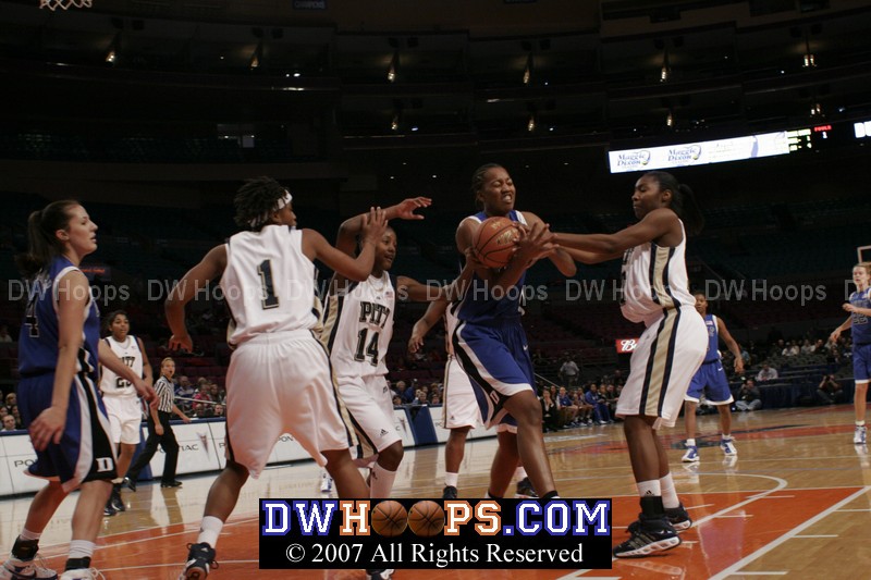 ...Chante Black tries to control the rebound from Carrem's miss...