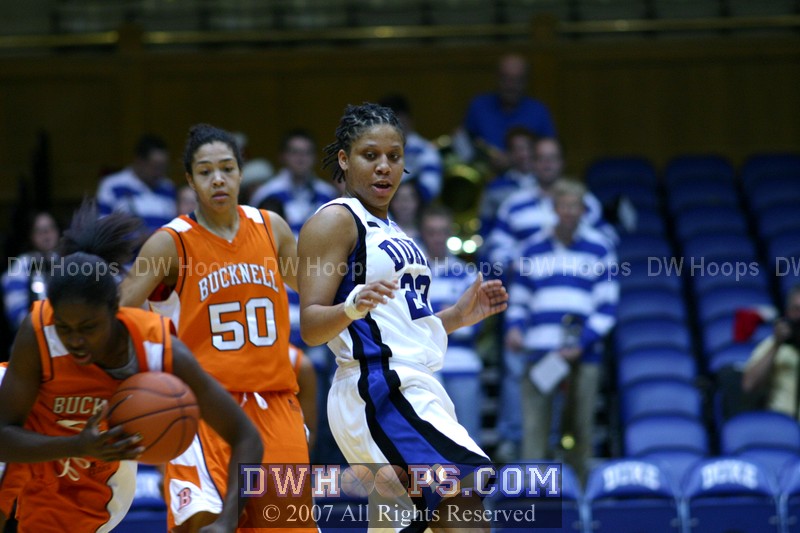 Wanisha Smith, still wearing a wrap on her wrist, watches a Bucknell turnover