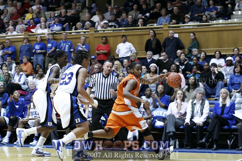 Bridgette Mitchell and Wanisha Smith press Amanda Brown in the backcourt