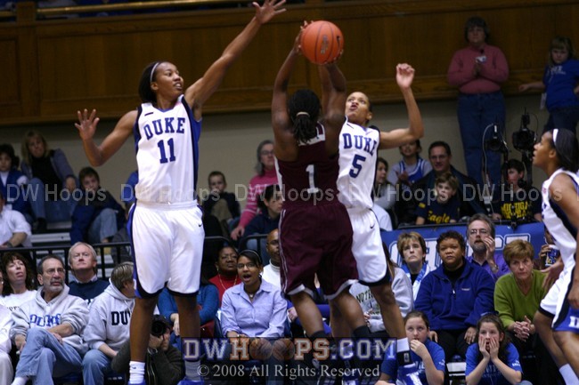 Jasmine Thomas blocks the shot of Lavonna Hailey