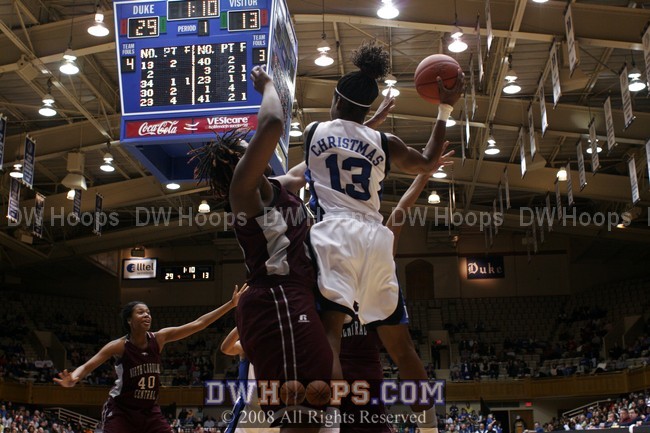 Karima Christmas leaps up to get the ball out of trouble