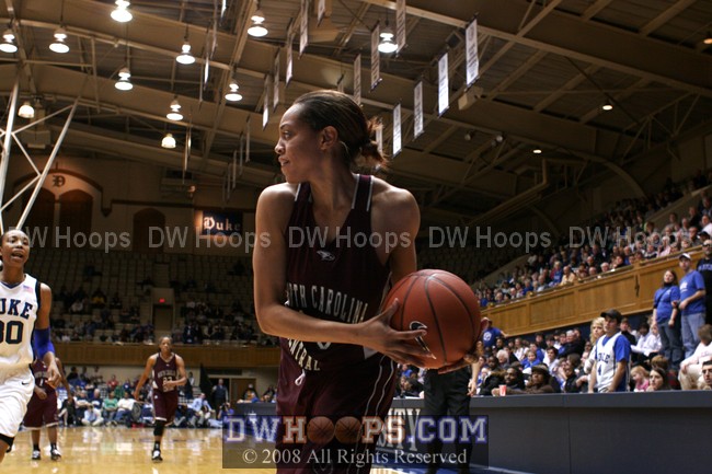 Keyonta Thacker looks to pass as Carrem Gay looms