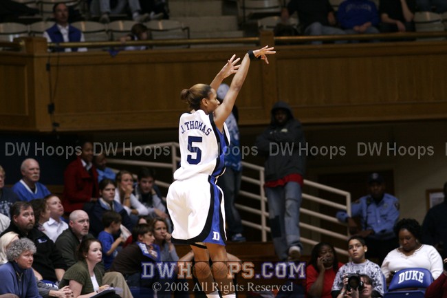 Jasmine Thomas attempts a three