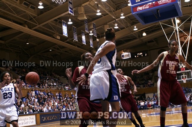 Jasmine Thomas goes behind the back to Wanisha Smith, but had already turned the ball over