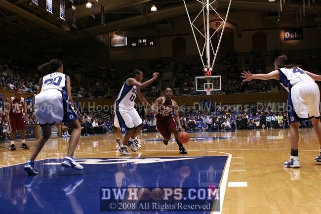 Shante Williams drives past Chante Black