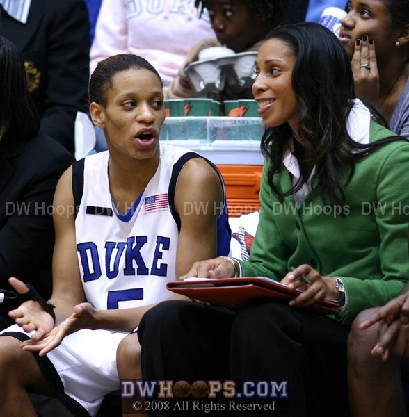 Up by 30, Jasmine and Shannon share a moment on the Duke bench