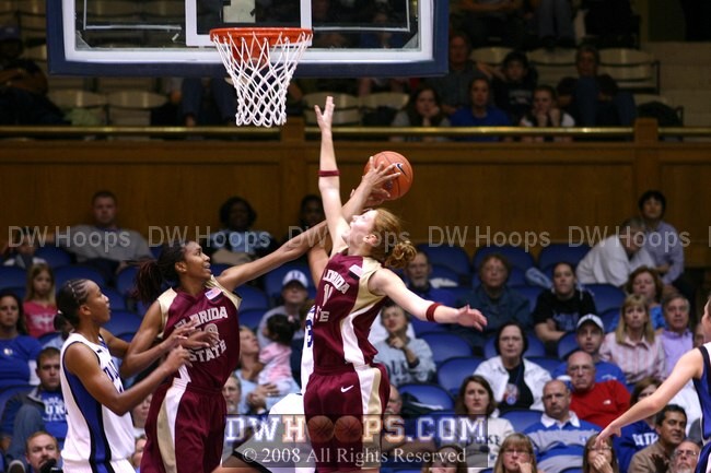 Monroe reaches across the lane to dislodge a potential Blue Devil rebound