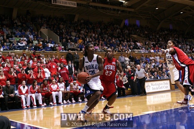 Keturah Jackson drives the baseline as Khadijah Whittington notes the State defensive breakdown