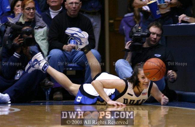 A bruised and battered Abby Waner dives yet again, this time for an errant Jasmine Thomas pass