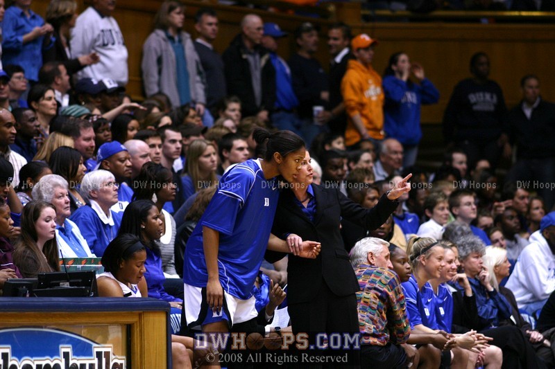 Coach McCallie counsels Krystal Thomas before sending her in