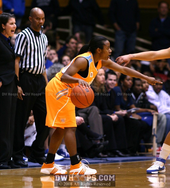 Shannon Bobbitt calls for a screen as Coach P calls to her team on D