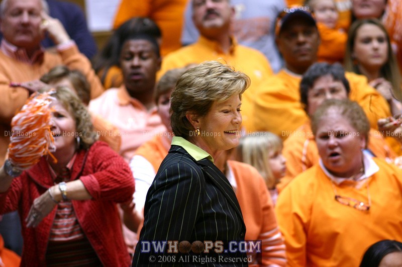 A light moment for Pat Summitt on the Tennessee sidelines, teased by the students for wearing green.