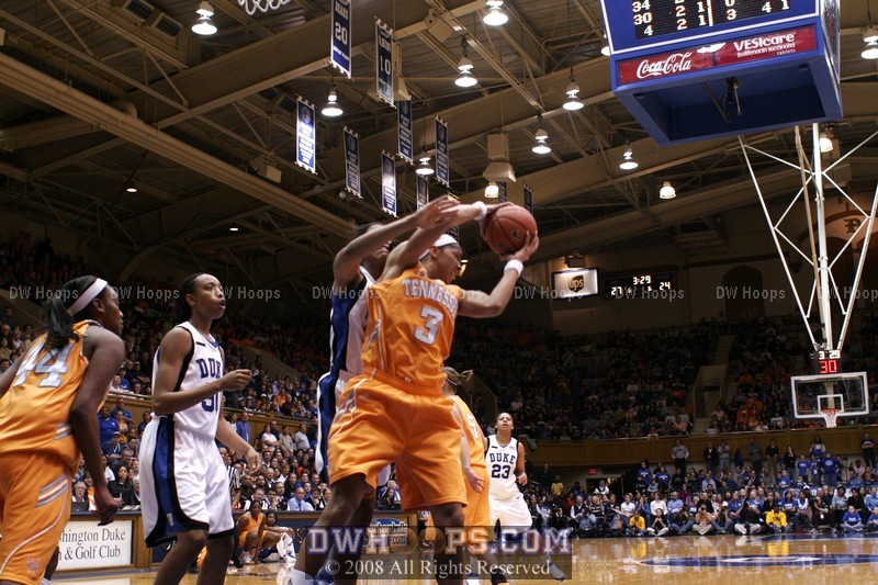 Krystal Thomas goes over the back as Candace Parker pulls down a rebound