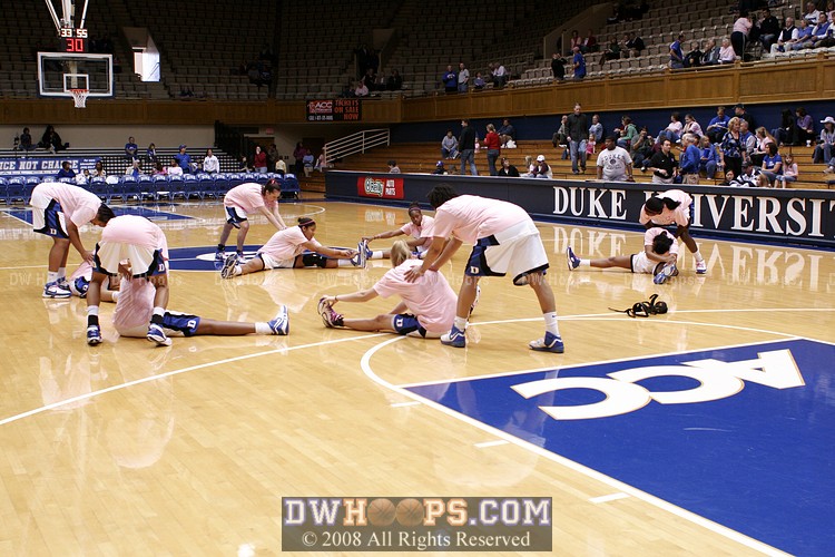 Duke stretches out in "Think Pink" warmup shirts