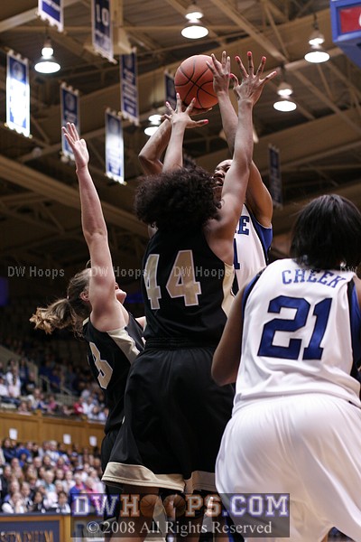 Chante Black shoots and scores over the outstretched fingertips of Mekia Valentine