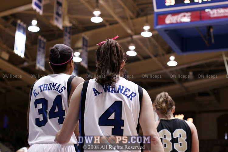 Abby Waner drives the lane and is fouled by Kem Wilson