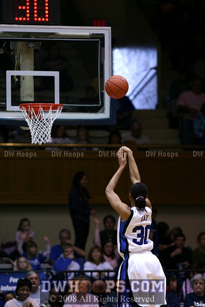 As light streams into the south end of Cameron, Carrem Gay completes a traditional three point play from the line