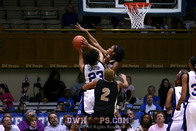 Wake center Mekia Valentine picks up her fourth foul trying to stop Wanisha Smith