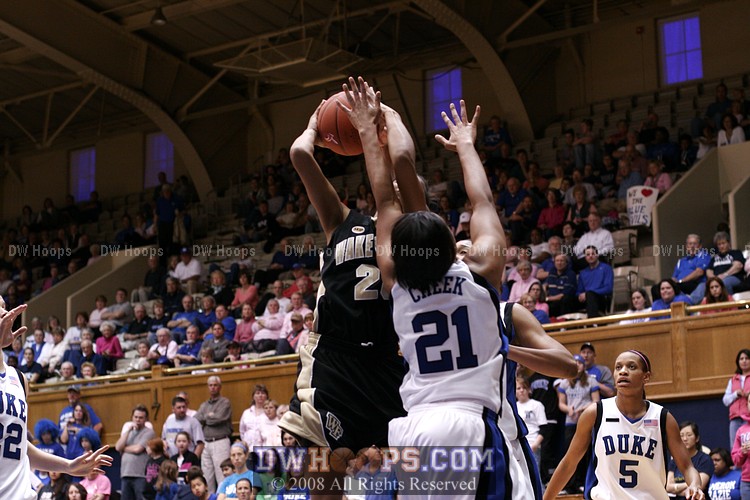 Somehow Brittany Waters powered through Joy's hand and converted this layup