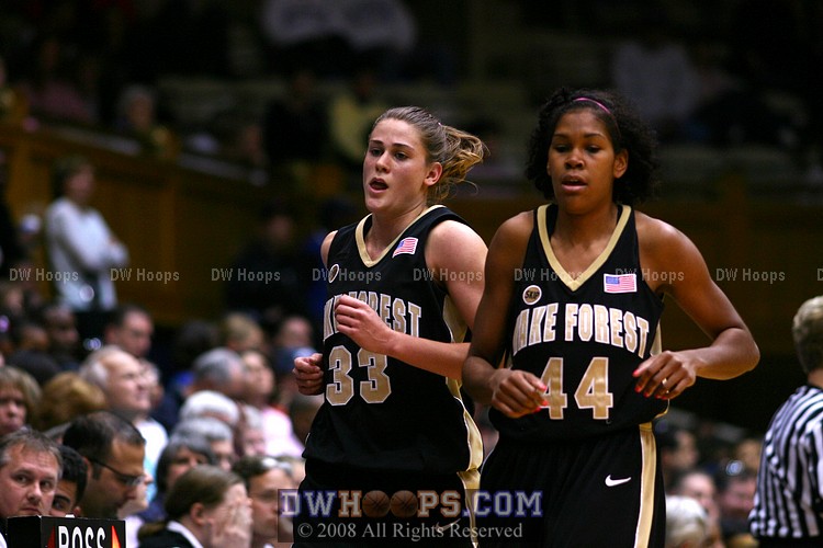 Corinne Groves and Mekia Valentine hustle to the Wake bench for a media time out