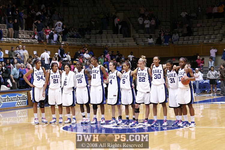 The 11 Blue Devils gather at mid-court for Dear Old Duke.