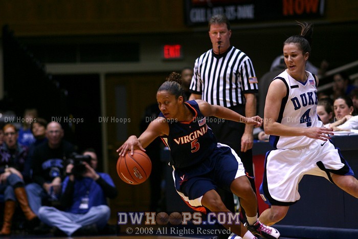 Sharnee Zoll dribbles away from Abby Waner