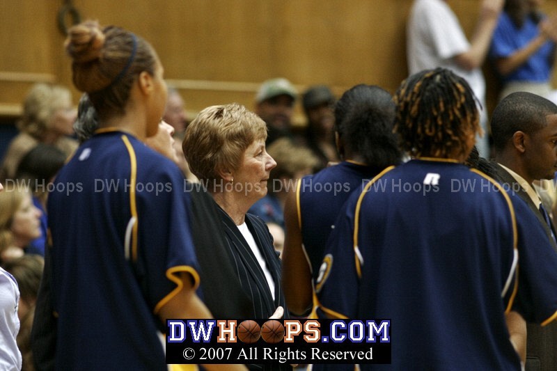 UNC Greensboro head coach Lynne Agee in the Spartan huddle