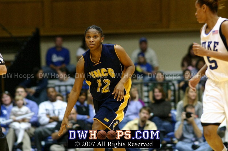 Greensboro's Lakiah Hyson brings the ball up court